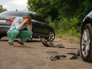 Upset male drivers after car accident on road